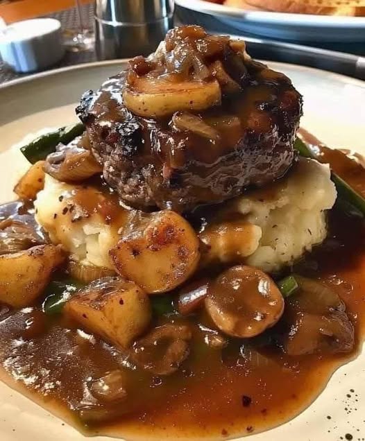 Salisbury steak with garlic mashed potatoes and mushroom & onion gravy