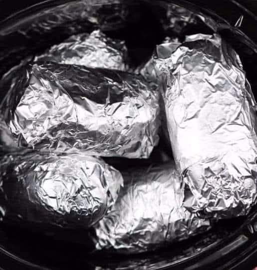 Wrap potatoes in tin foil and put in crock pot February